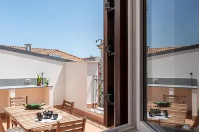 an open hallway with a living room with a television at Oretea Apartment with Terrace by Wonderful Italy in Palermo
