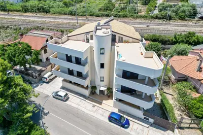 an aerial view of a building with a tower at Oltre il Mare Trabia in Trabia