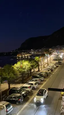 a bunch of cars parked in a parking lot at night at Casa vacanze anto antonella in Bagheria