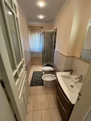 a bathroom with a shower and a toilet and a sink at Casa delle Stelle in Mondello