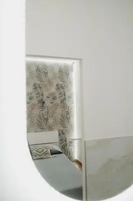 a mirror in a room with a wall at Barù home in centro in Palermo