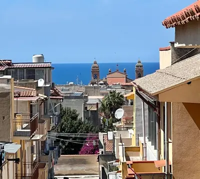 a view of the city from the roofs of buildings at NOVIMO Comfort Apartment with elevator & secure privat parking in Terrasini