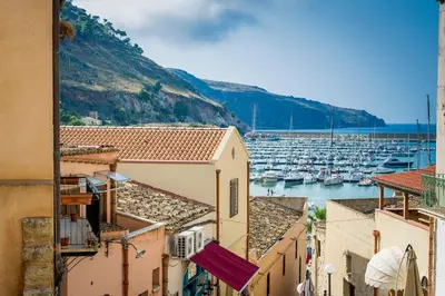 a view of a harbor with boats in the water at Le Scalette in Castellammare del Golfo