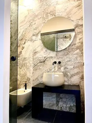 a bathroom with a sink and a mirror at Amari120Suite&Spa in Palermo