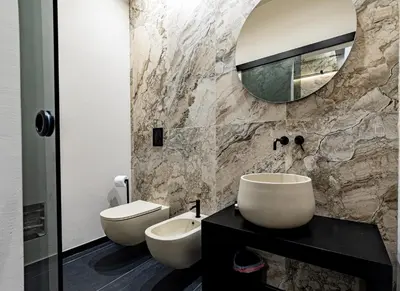 a bathroom with a sink and a toilet and a mirror at Amari120Suite&Spa in Palermo