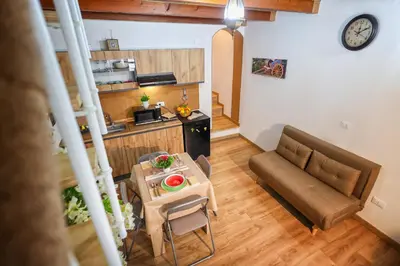 a living room with a couch and a table at La Casa di Sughero in Palermo