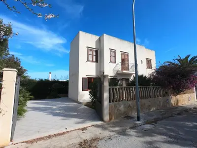 a white building on the side of a street at Villa Ipomea in San Vito lo Capo