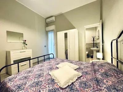 a bedroom with a large bed with a blanket at Angelia in Capaci