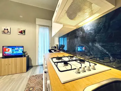 a kitchen with a stove and a counter top at Angelia in Capaci