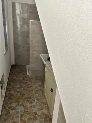 a small bathroom with a sink and a shower at Le Tremar Carini Poseidon in Carini