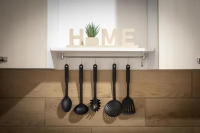 a group of utensils hanging on a wall at Scalini holiday in Castellammare del Golfo
