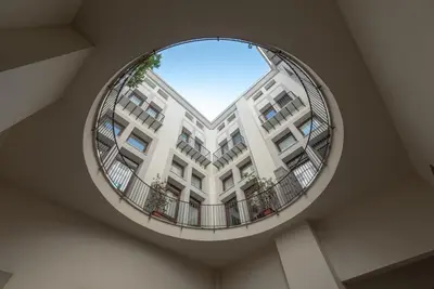 a circular mirror in the ceiling of a building at Lumar Sicilia - Quaroni in Palermo