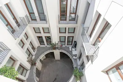 an overhead view of a building with a circular courtyard at Lumar Sicilia - Quaroni in Palermo
