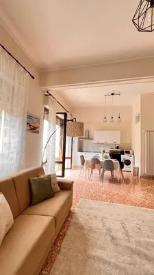 a living room with a couch and a table at Kasa Stabile in Palermo