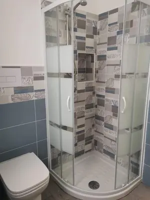 a bathroom with a shower and a toilet at Casa Vacanze il Cortile in Casteldaccia