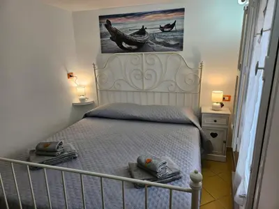 a bedroom with a bed with two towels on it at Casa Pretoria in Palermo
