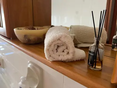 a towel sitting on a counter in a bathroom at Nonna Ciccina’s House in Vita