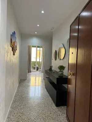 a hallway with a bathroom with a vanity and a mirror at Karma House in Palermo