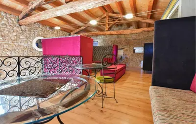 a living room with a glass table and chairs at 3 Bedroom Amazing Home In Partinico in Partinico