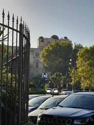 a group of cars parked next to a fence at Casa Kyla in Palermo