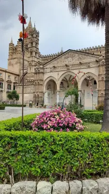 a large building with pink flowers in front of it at Casa Kyla in Palermo