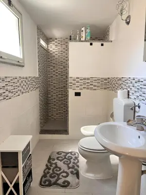 a bathroom with a toilet and a sink at FM Home Stadio Renzo Barbera in Palermo