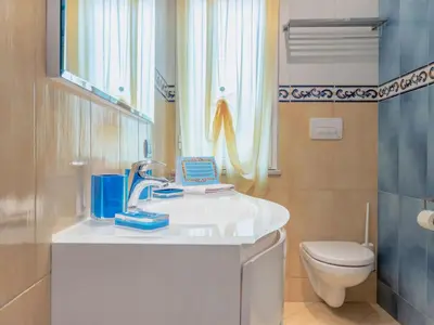 a bathroom with a sink and a toilet at Villa Olivella by Interhome in Cefalù
