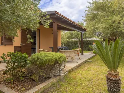 a garden with a wooden deck and a pergola at Villa Olivella by Interhome in Cefalù