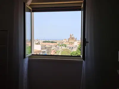 an open window with a view of a city at Skyline Palermo in Palermo