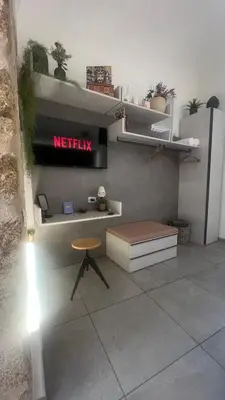 a meeting room with a desk and a stool at LA SPLENDIDA Dimora di Charme - Luxury Loft Palermo in Palermo