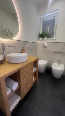 a bathroom with a sink and a toilet at LA SPLENDIDA Dimora di Charme - Luxury Loft Palermo in Palermo