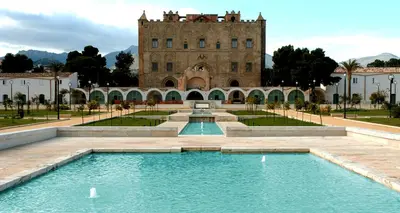 a building with a swimming pool in front of a building at LA SPLENDIDA Dimora di Charme - Luxury Loft Palermo in Palermo