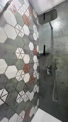 a bathroom with a shower with a mosaic tile wall at LA SPLENDIDA Dimora di Charme - Luxury Loft Palermo in Palermo