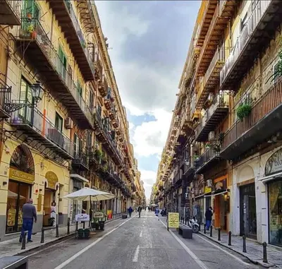 an empty street in a city with buildings at Sicily guest house 2 in Palermo