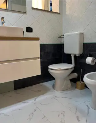 a bathroom with a toilet and a sink at Sicily guest house 2 in Palermo
