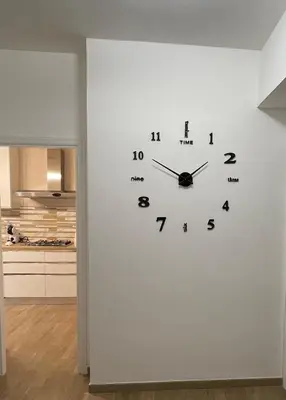 a clock on a wall in a room at Panormus Guest Apartment in Palermo