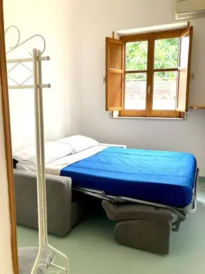 a hospital bed in a room with a window at Villa Orlando Mondello in Palermo