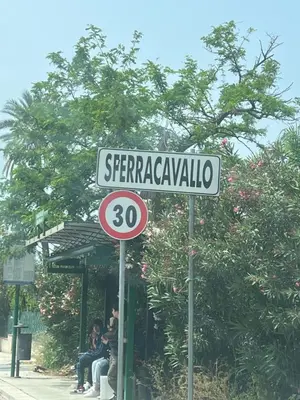 a street sign for serrarawkaulla on a street at Casa Sciàlari in Palermo