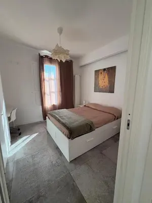 a bedroom with a bed and a window at Aerial House in Palermo
