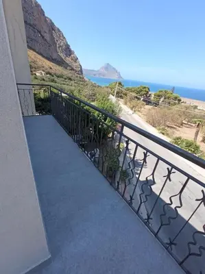 a balcony of a building with a view of the ocean at Makari Sweet Sunsets in Macari