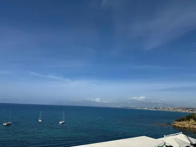 a large body of water with boats in it at Umàri Rooms in Castellammare del Golfo