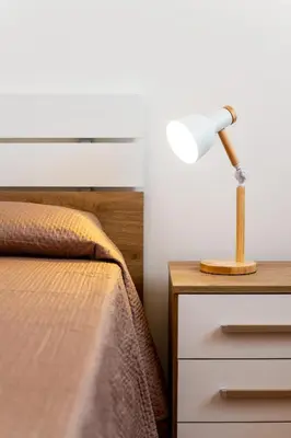 a bedroom with a bed and a lamp on a nightstand at Villa Diamante in Campofelice di Roccella