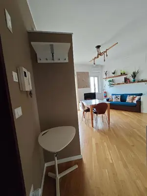 a living room and dining room with a table and chairs at Il Balcone sul mare - free parking & relax in Palermo