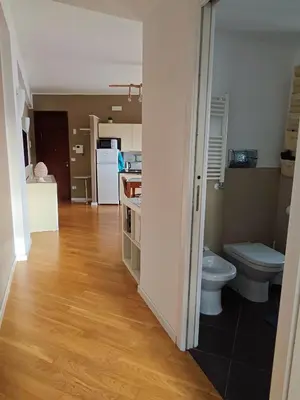 a bathroom with a toilet and a sink in a room at Il Balcone sul mare - free parking & relax in Palermo