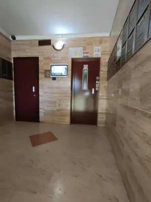 a hallway with two elevators and a door in a building at Il Balcone sul mare - free parking & relax in Palermo