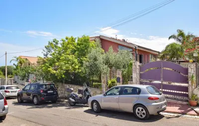 a group of cars parked on the side of a street at Awesome Apartment In Trabia in Trabia