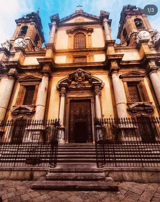 a large building with a staircase in front of it at LION'S Room in Palermo