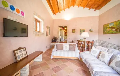 a living room with a couch and a tv at Awesome Home In Palazzo Adriano in Palazzo Adriano