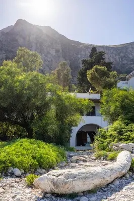 a house with a mountain in the background at Casa Eugenia in Santa Flavia