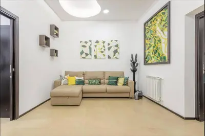 a living room with a couch with pillows on it at La casa di Alice in Palermo